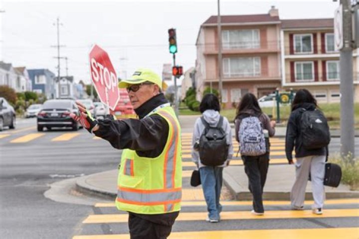 Who are crossing guards employed?